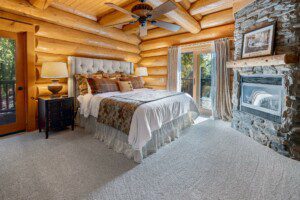 Rustic bedroom setting in Moosehead Lodge, the ideal large group cabin Yosemite guests love