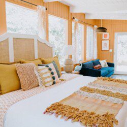 Spacious bedroom with a large cozy bed in a lake bungalow rental near Yosemite