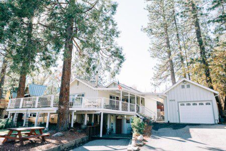 Cozy mountain house at Bass Lake family rental with game room, surrounded by nature