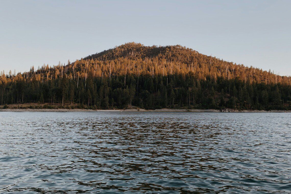 Scenic day trips from Bass Lake with clear lake views and lush forest landscape