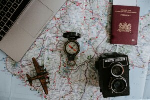 Yosemite multi-day itinerary preparation with travel essentials like map, camera, passport, and laptop for trip planning