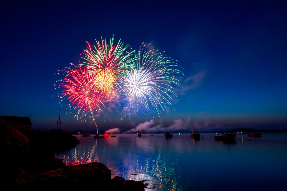 Spectacular fireworks show over the water during the Bass Lake 4th of July celebration.