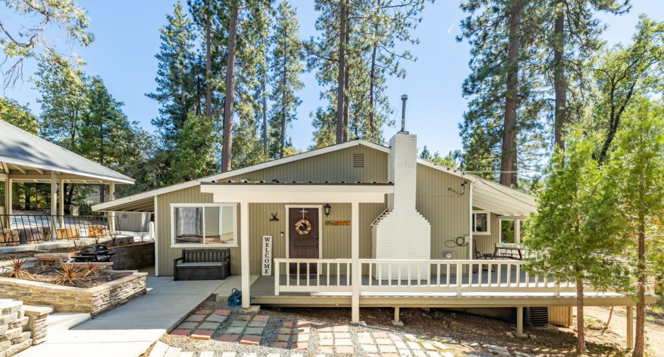A exterior view of a Thayne Wyoming vacation rentals home with a mountain backdrop